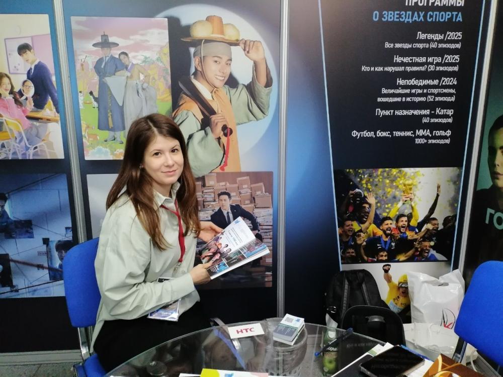 A stand at World Content Market with program posters and a catalog